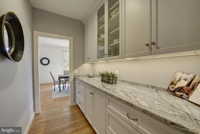 a room with a chair and a window