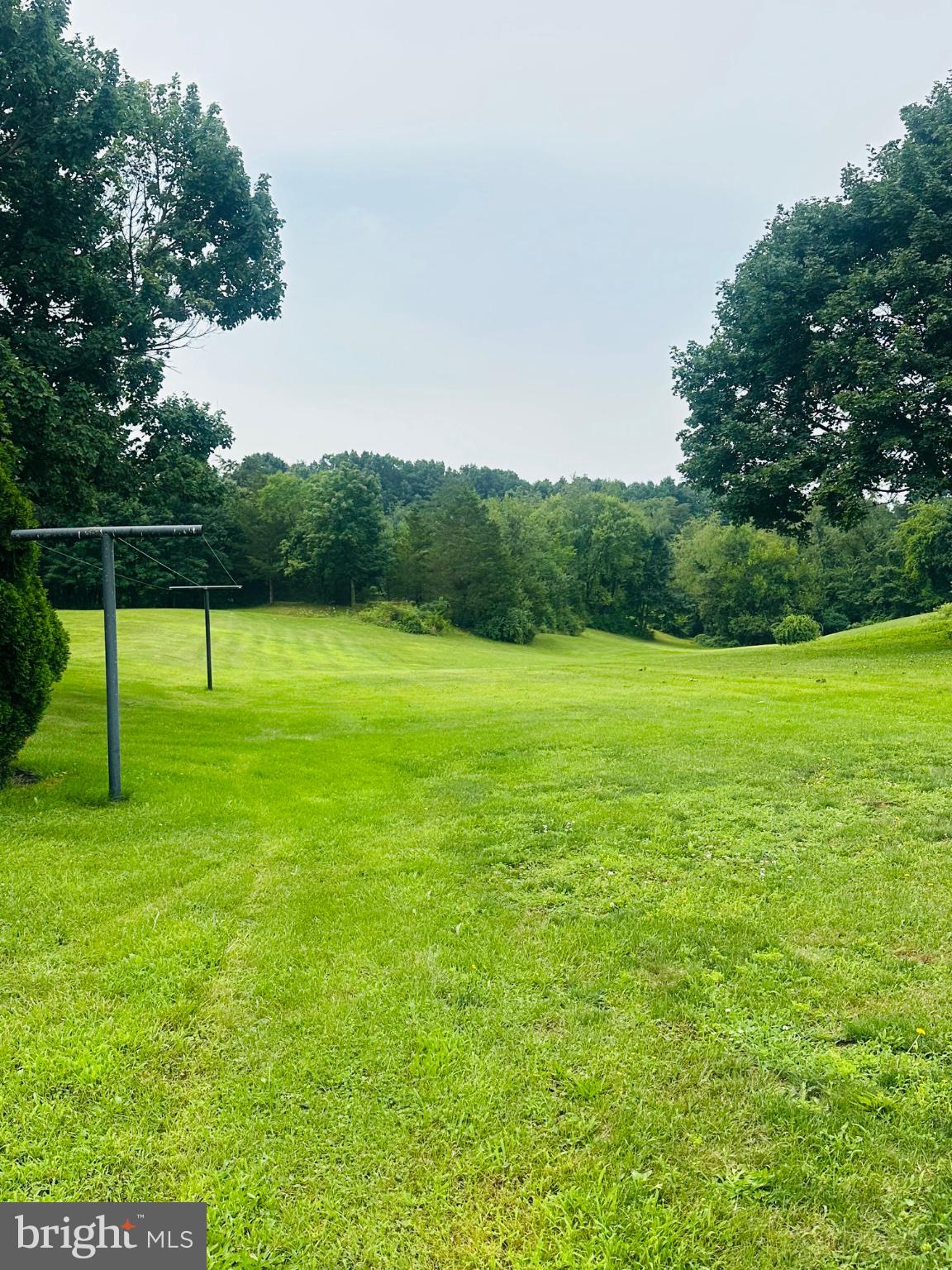 1634 Crottlestown Road Chambersburg, PA 17202 - Photo 28 of 37 Lush green landscape under a cloudy sky.
