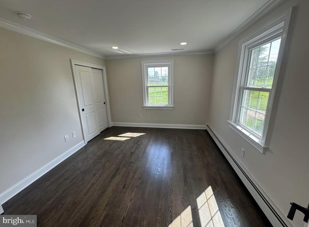 55 Apple Hill Road Furlong, PA 18925 - Photo 19 of 30 an empty room with wooden floor and windows