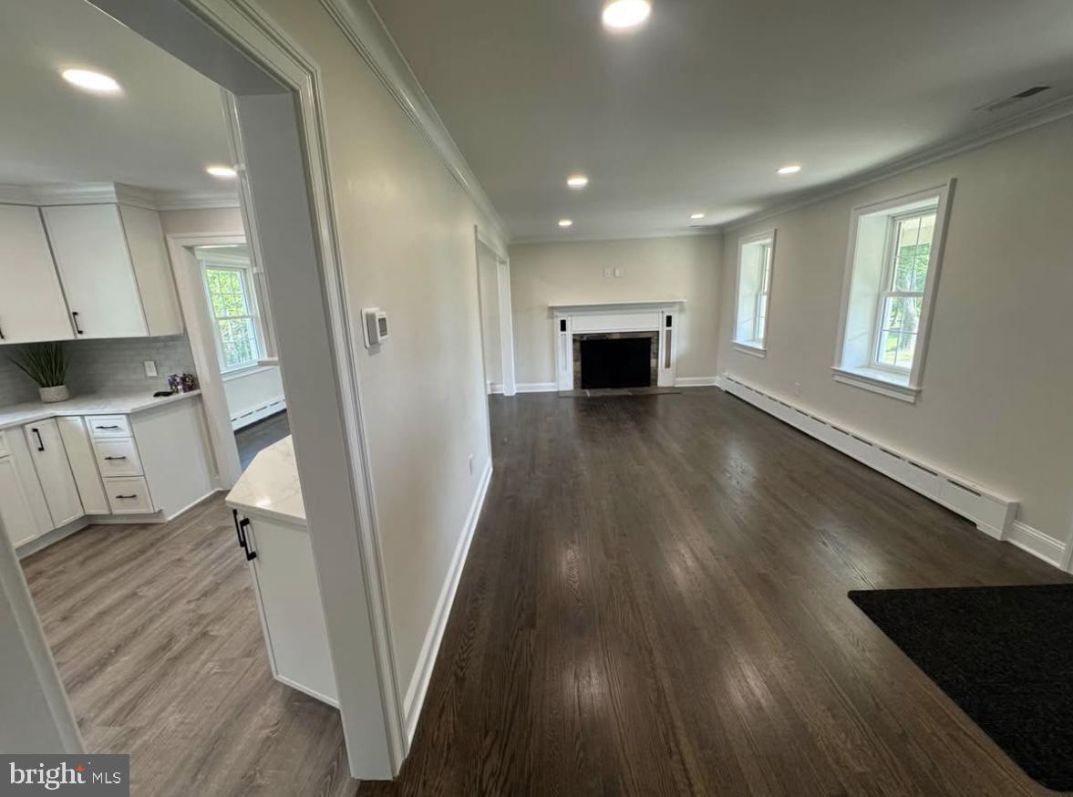 55 Apple Hill Road Furlong, PA 18925 - Photo 10 of 30 wooden floor in an empty room with a fireplace