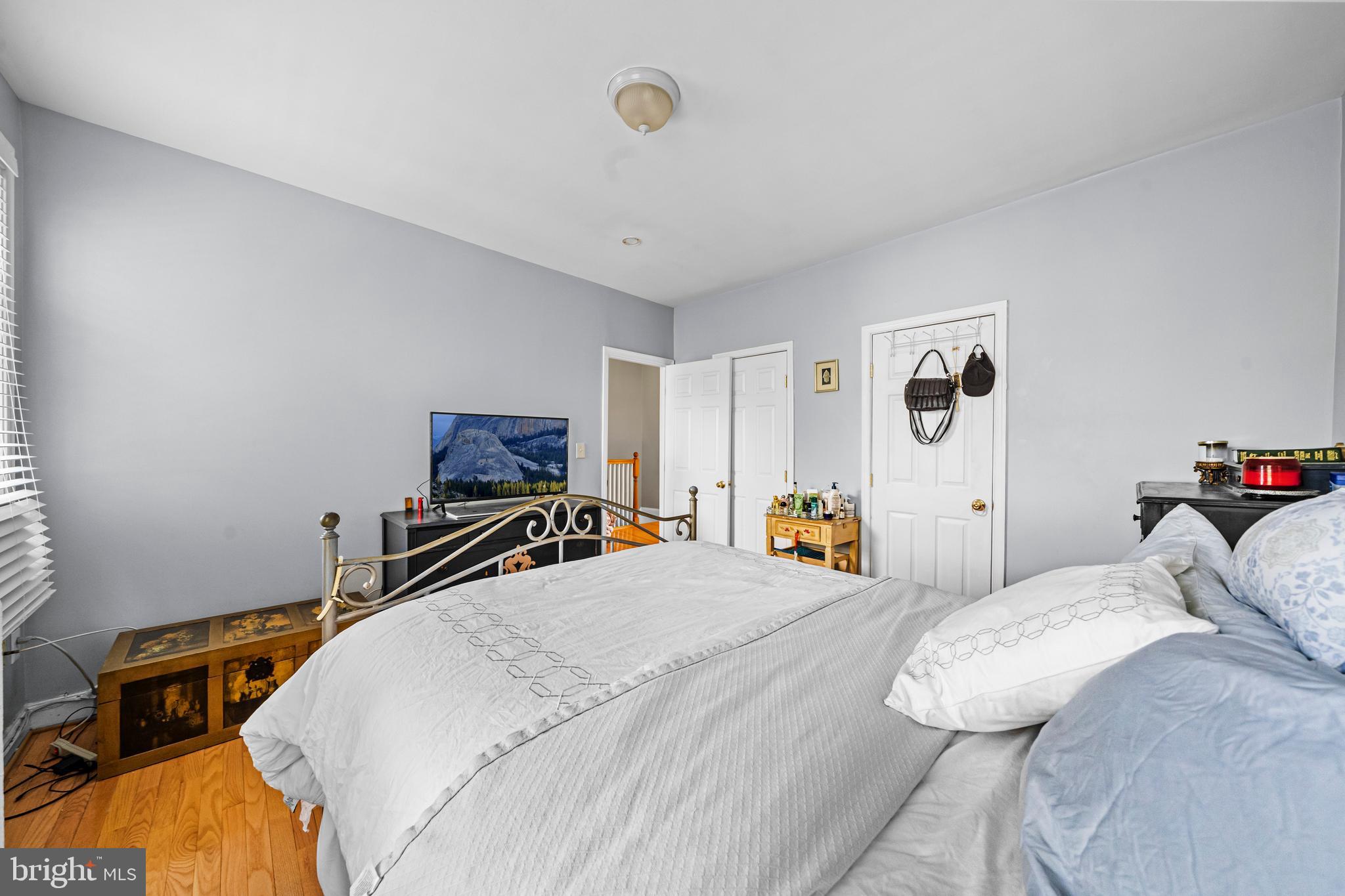 504 Kenyon Street Northwest Washington, DC 20010 - Photo 14 of 38 a bedroom with bed and a tv