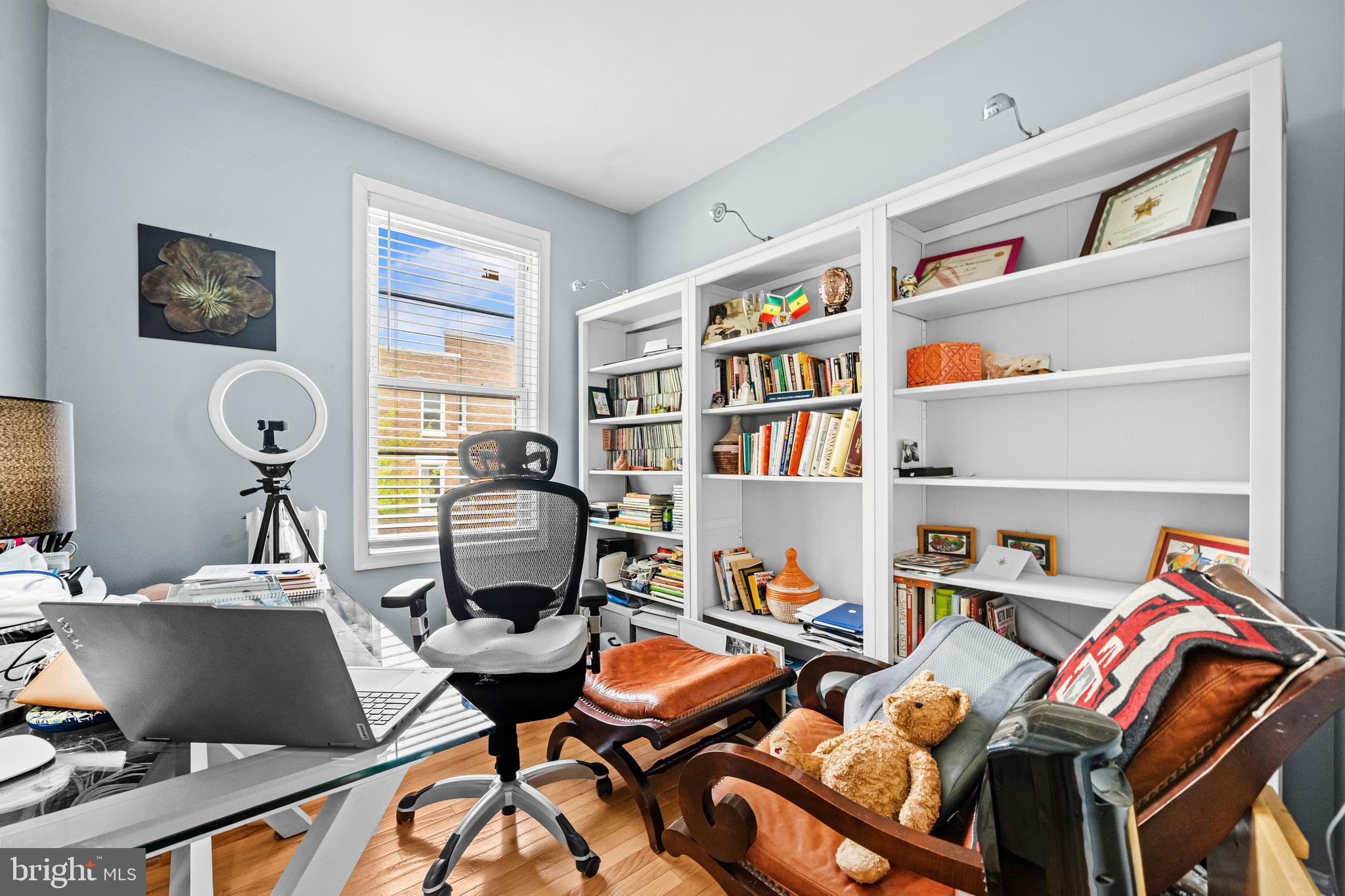 504 Kenyon Street Northwest Washington, DC 20010 - Photo 16 of 38 a work room with furniture and a book shelf