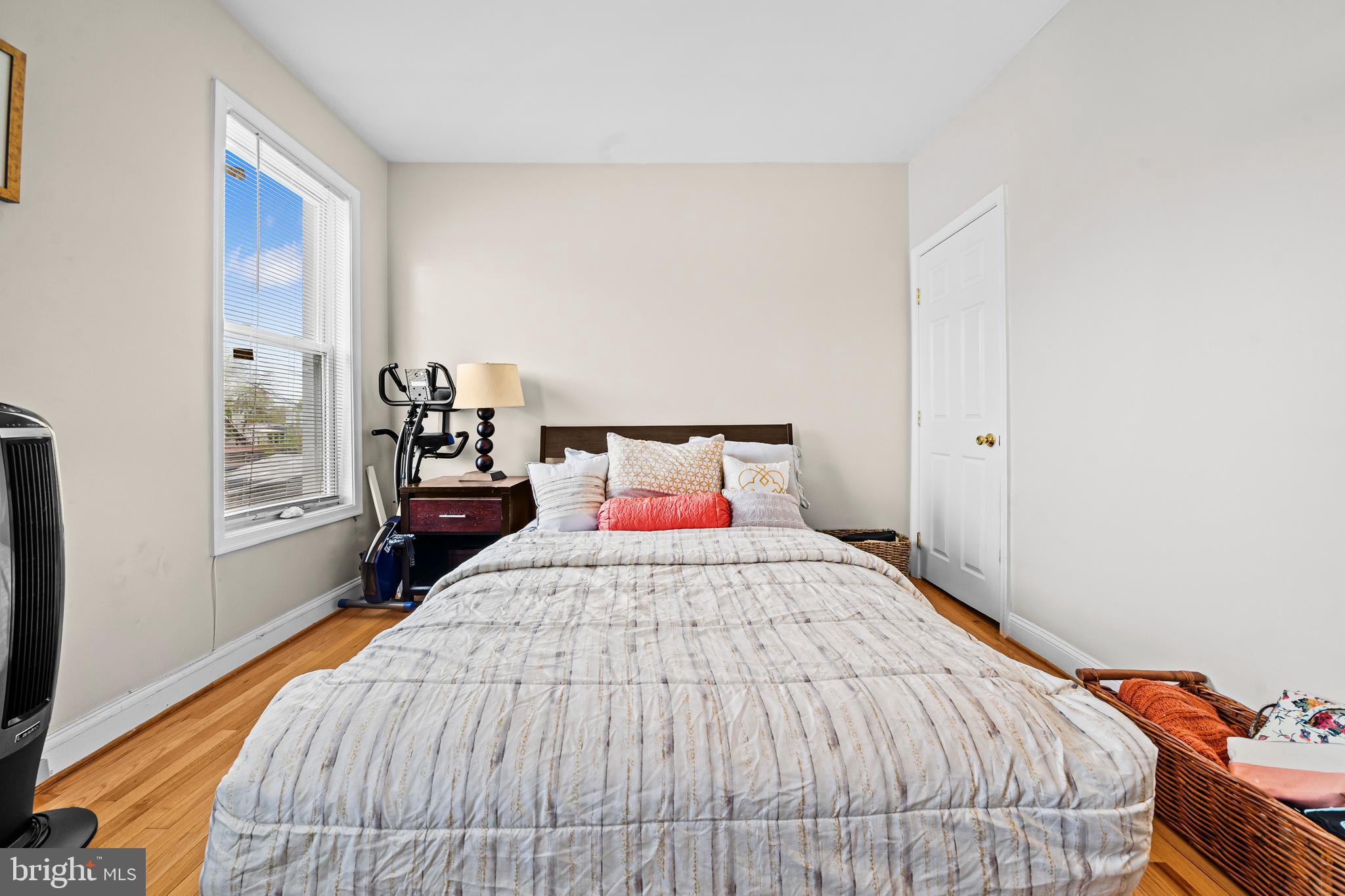 504 Kenyon Street Northwest Washington, DC 20010 - Photo 18 of 38 a bedroom with a bed and window