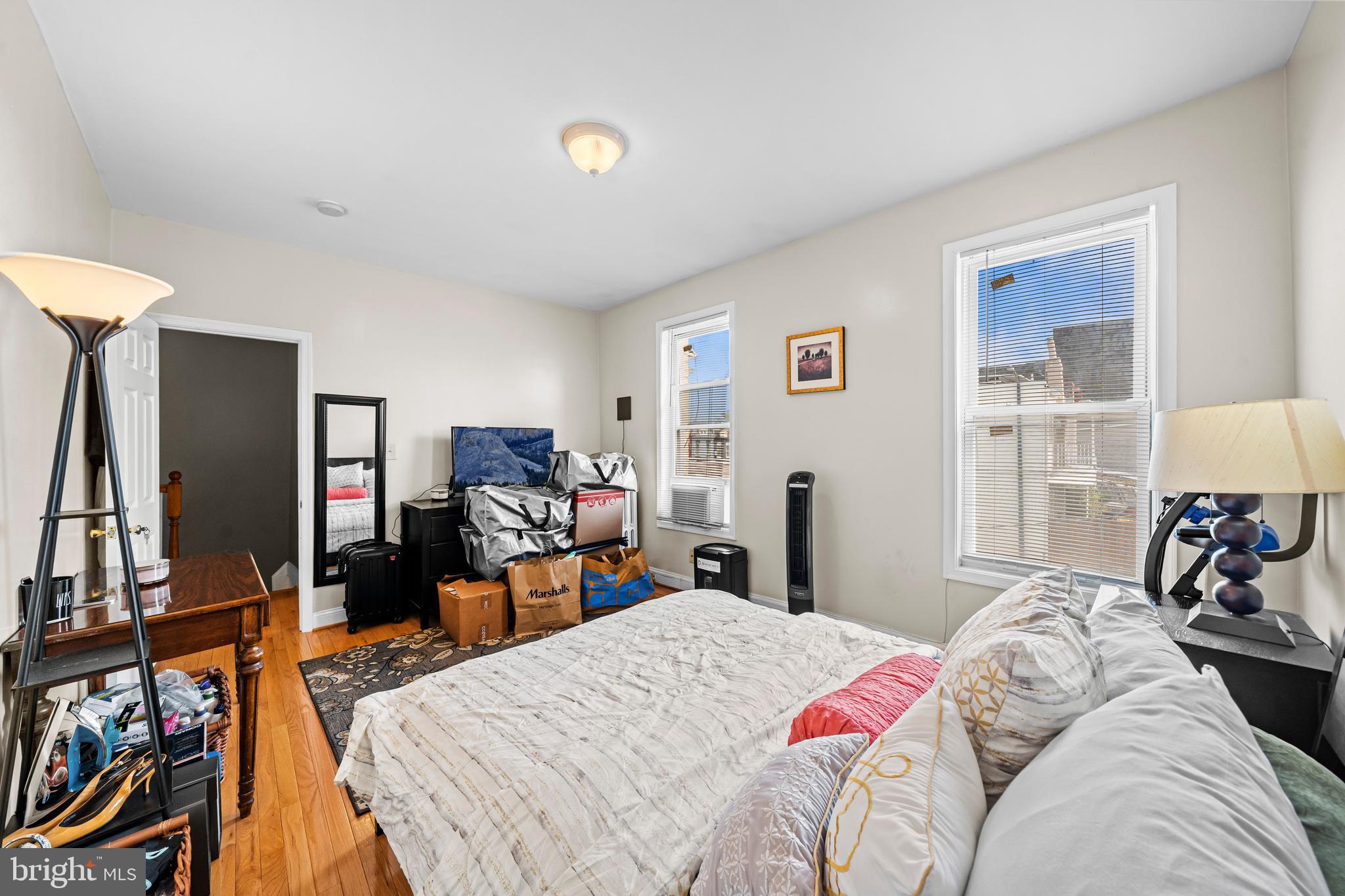 504 Kenyon Street Northwest Washington, DC 20010 - Photo 21 of 38 a bed room with a bed and a tv