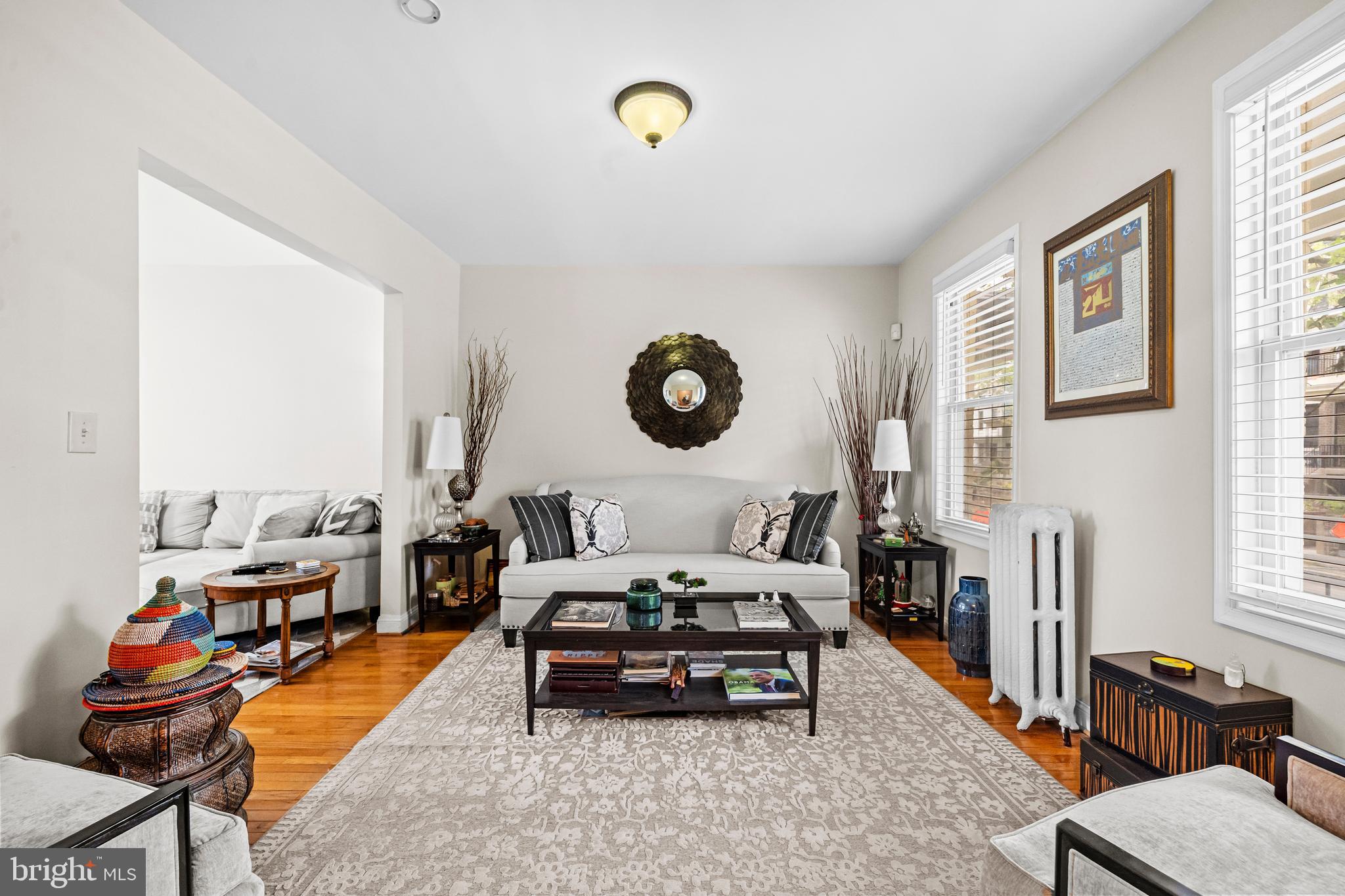 504 Kenyon Street Northwest Washington, DC 20010 - Photo 4 of 38 a living room with furniture a rug and a window