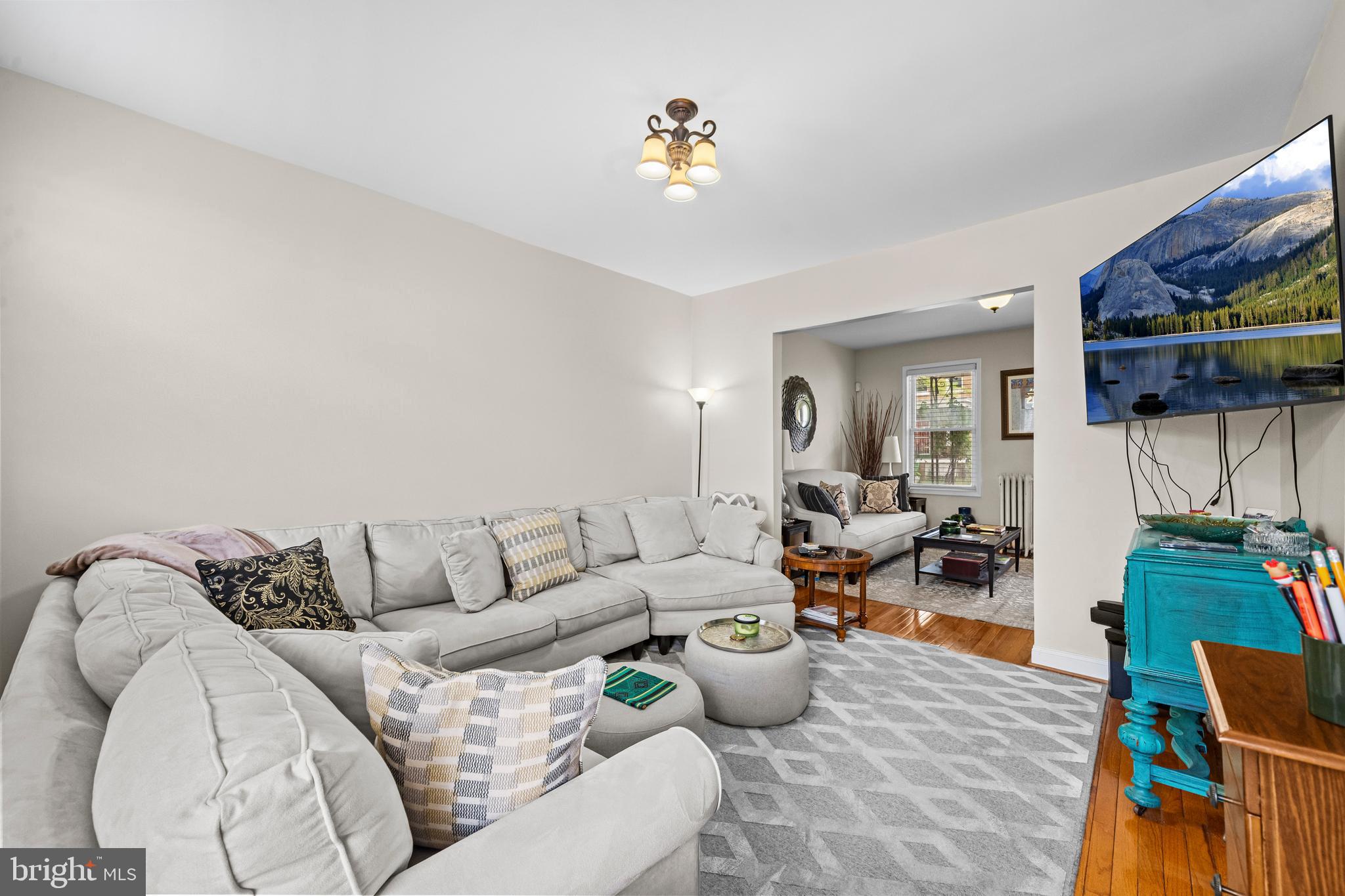 504 Kenyon Street Northwest Washington, DC 20010 - Photo 8 of 38 a living room with furniture and a wooden floor