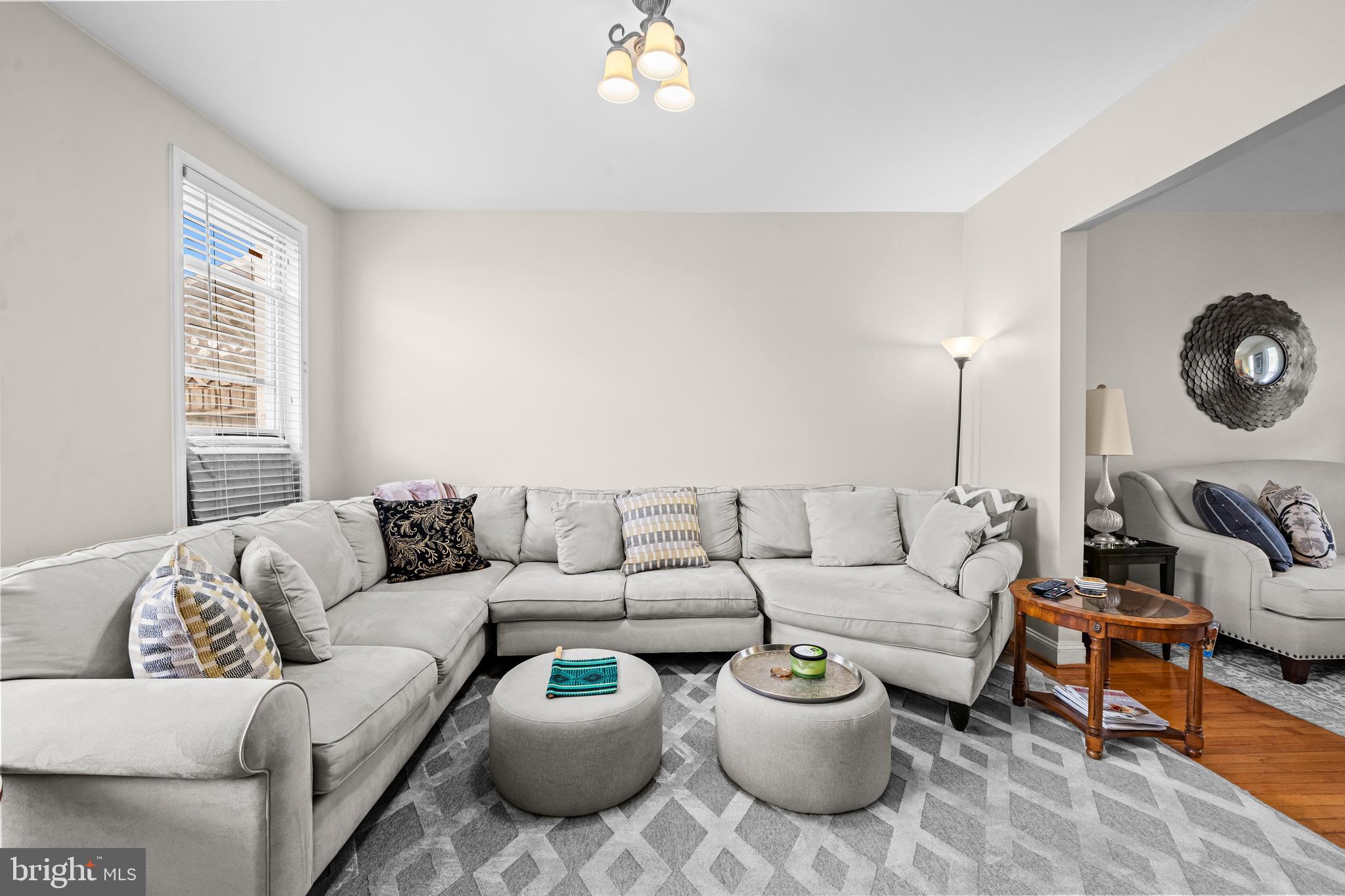 504 Kenyon Street Northwest Washington, DC 20010 - Photo 10 of 38 a living room with furniture and a large window