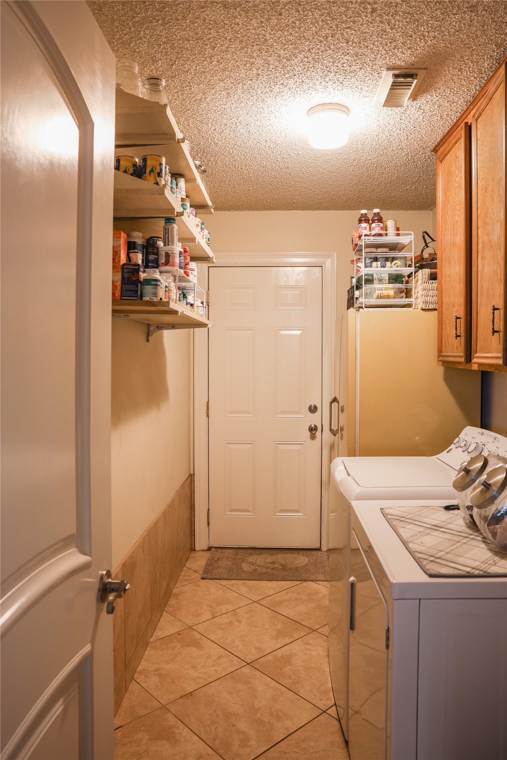 318 Peach Point Road Jones Creek, TX 77541 - Photo 12 of 27 a room with storage and utility