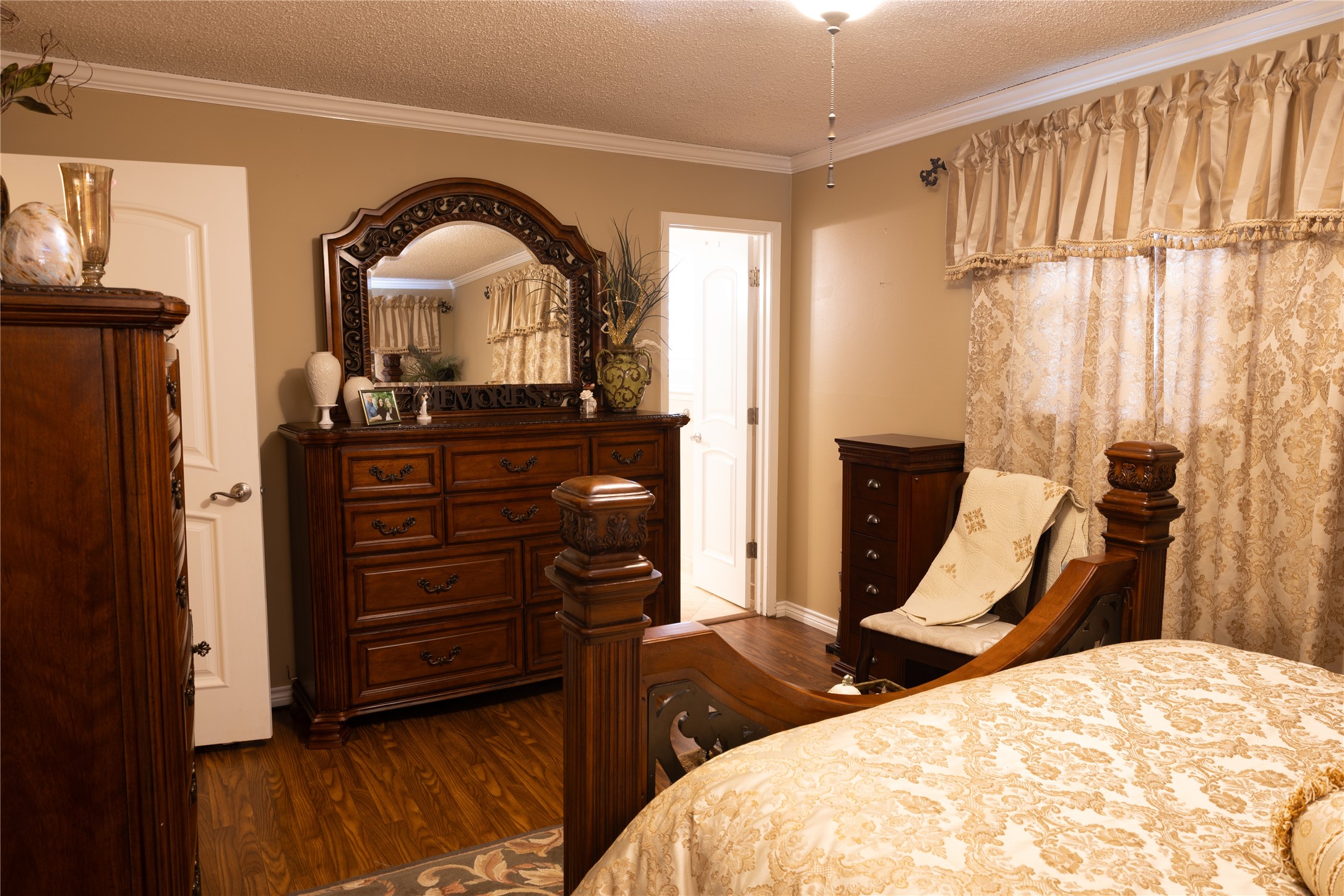 318 Peach Point Road Jones Creek, TX 77541 - Photo 15 of 27 a bedroom with two beds and a dresser