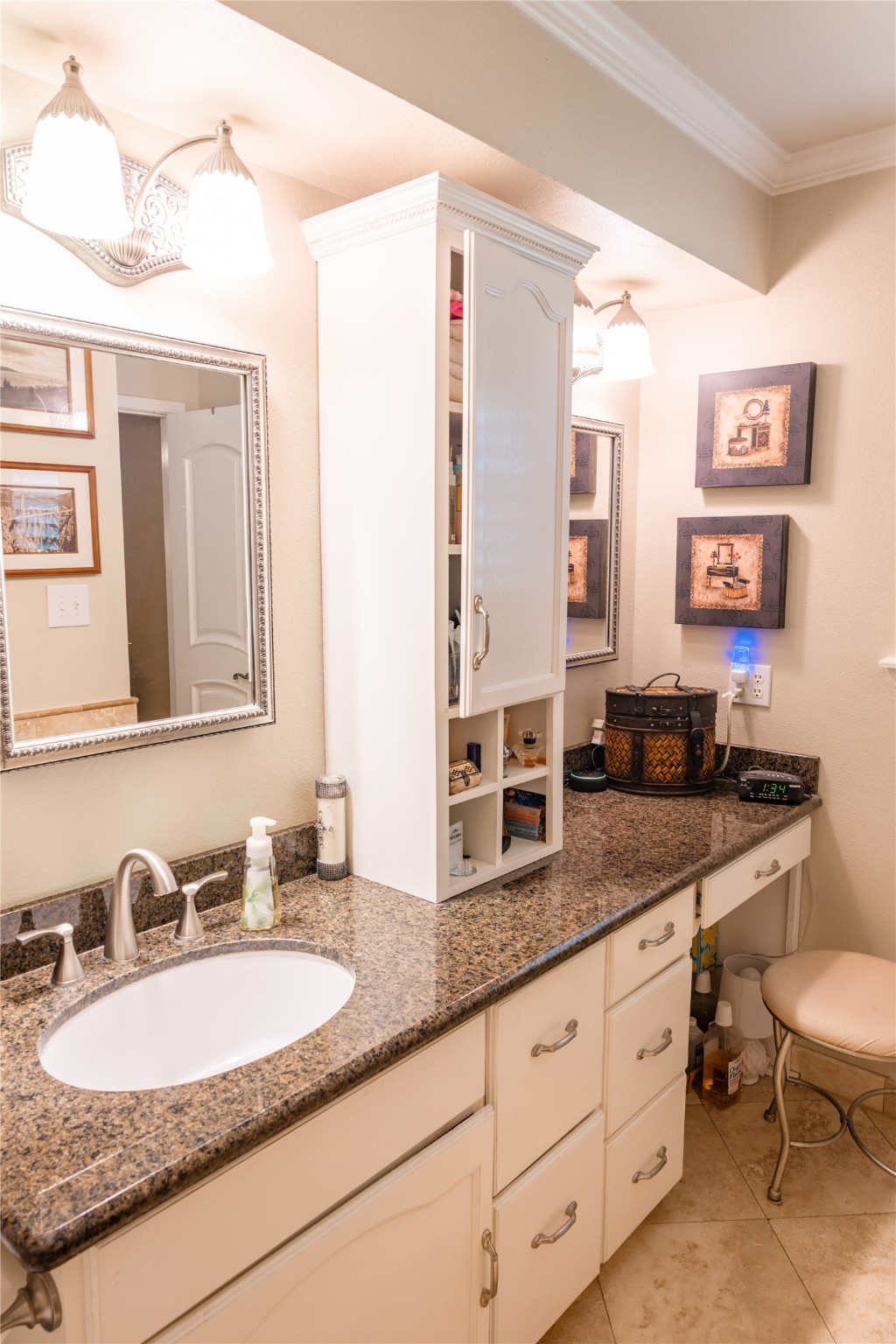 318 Peach Point Road Jones Creek, TX 77541 - Photo 17 of 27 a bathroom with a granite countertop double vanity sink and a mirror