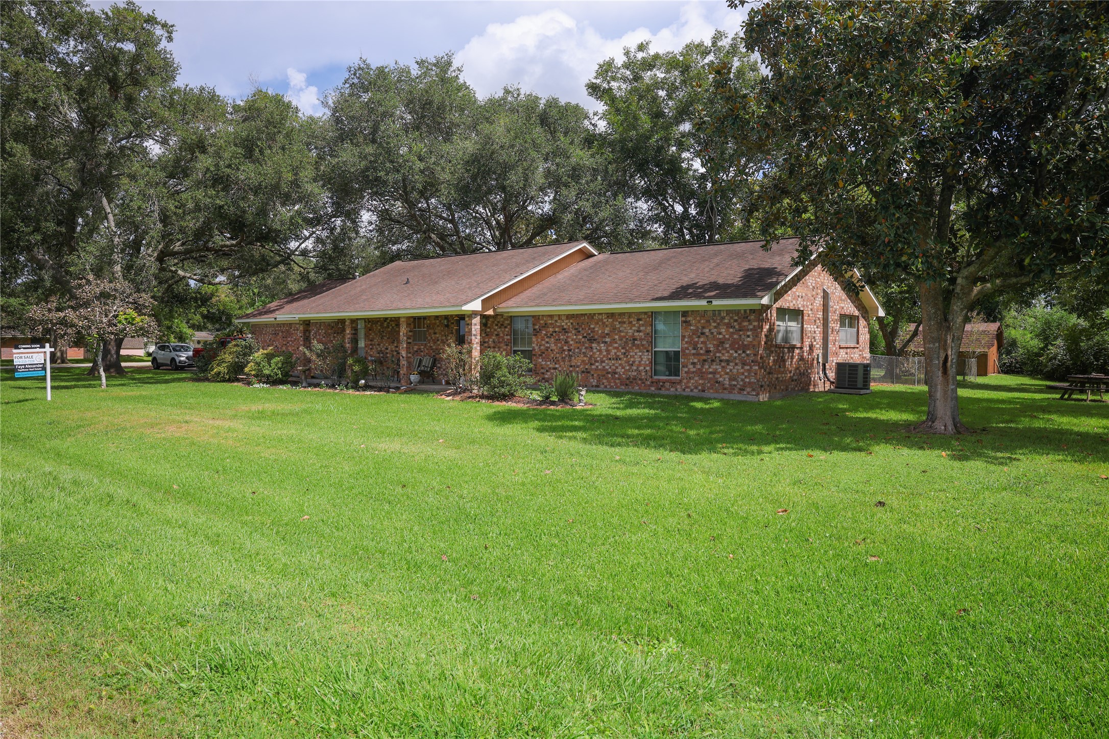 318 Peach Point Road Jones Creek, TX 77541 - Photo 2 of 27 a view of a house with a yard