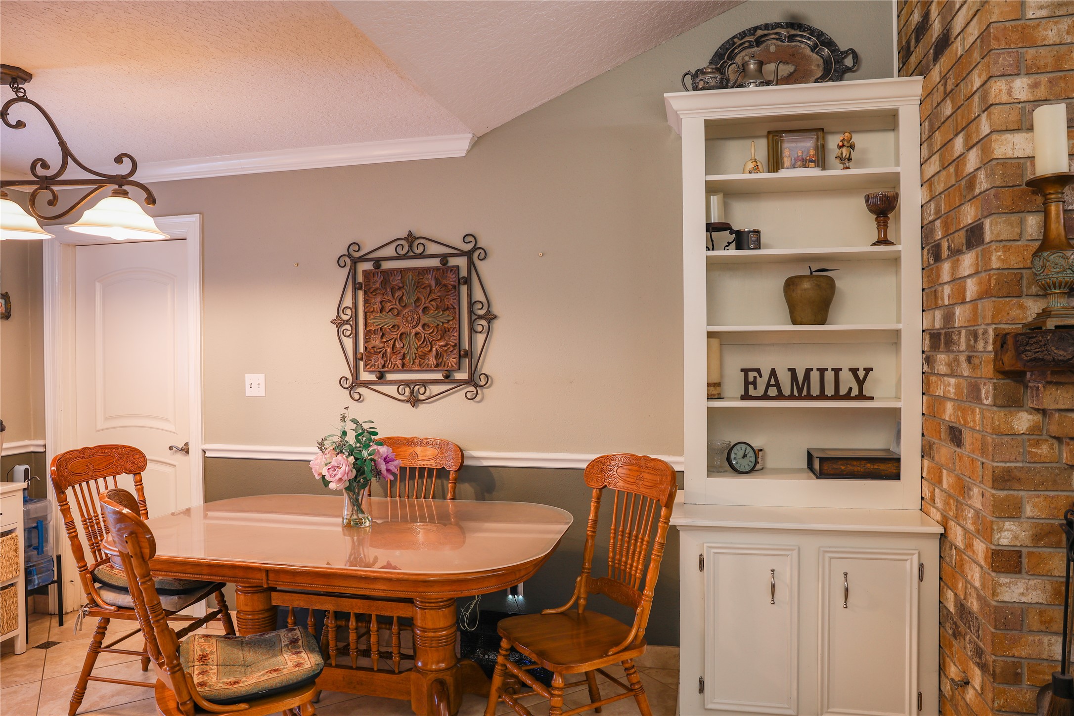 318 Peach Point Road Jones Creek, TX 77541 - Photo 9 of 27 a view of a dining room with furniture and wooden floor