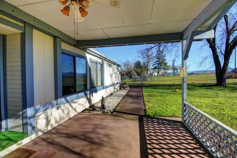 8085 High Banks Road Central Point, OR 97502 - Photo 6 of 35 a view of a porch with furniture and garden