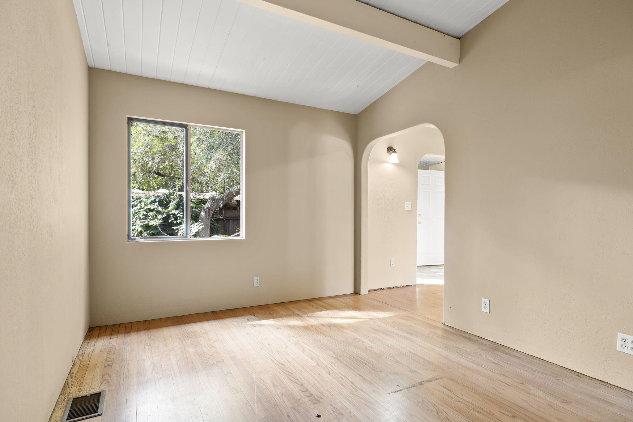 5130 Cathedral Oaks Road Santa Barbara, CA 93111 - Photo 14 of 68 an empty room with wooden floor and windows