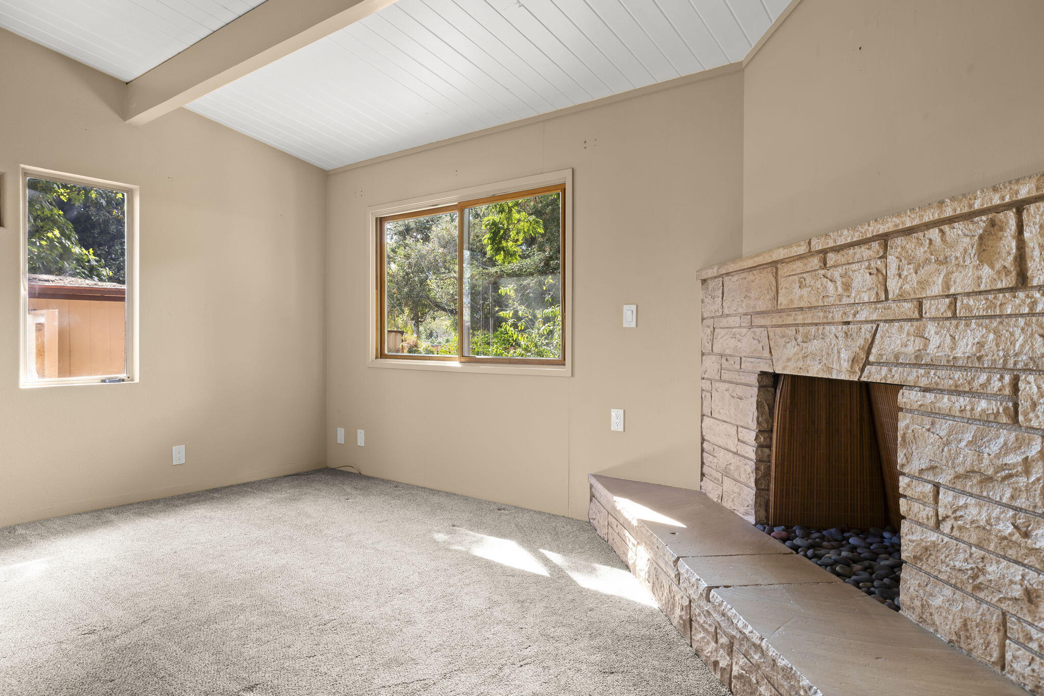 5130 Cathedral Oaks Road Santa Barbara, CA 93111 - Photo 20 of 68 a view of an empty room with a fireplace and a window