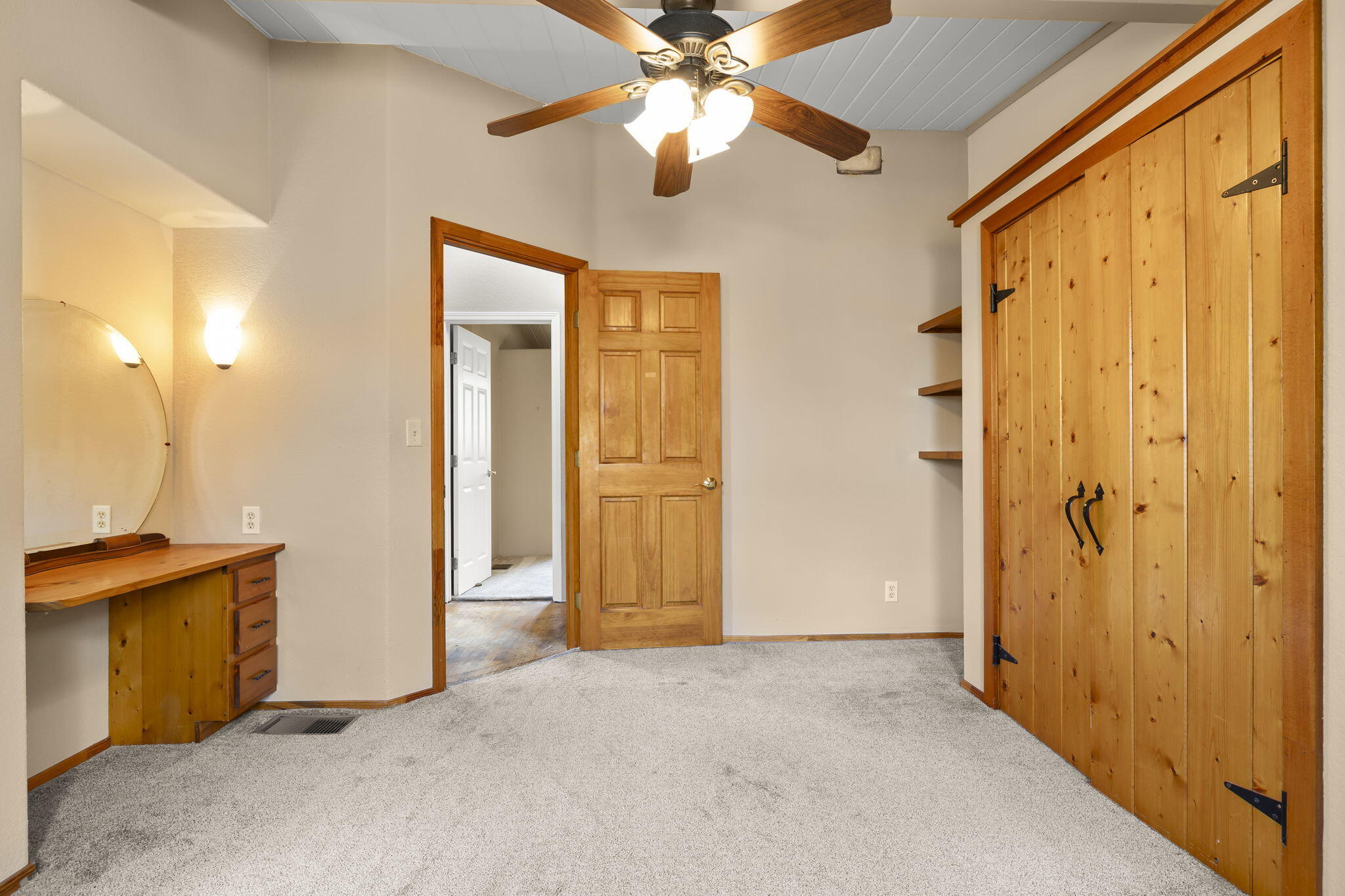 5130 Cathedral Oaks Road Santa Barbara, CA 93111 - Photo 29 of 68 an empty room with closet and a chandelier fan