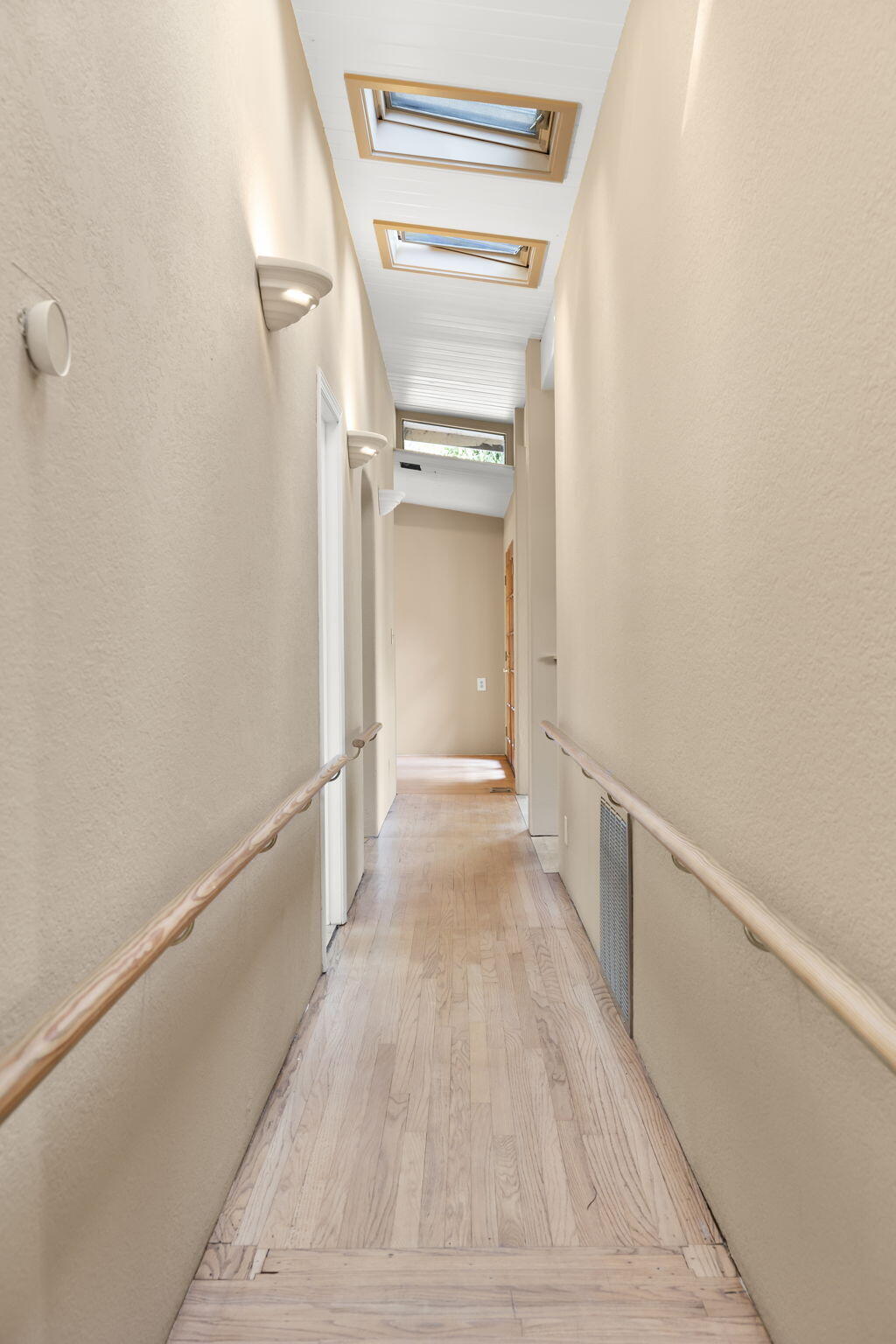 5130 Cathedral Oaks Road Santa Barbara, CA 93111 - Photo 33 of 68 a view of a hallway with wooden floor and staircase