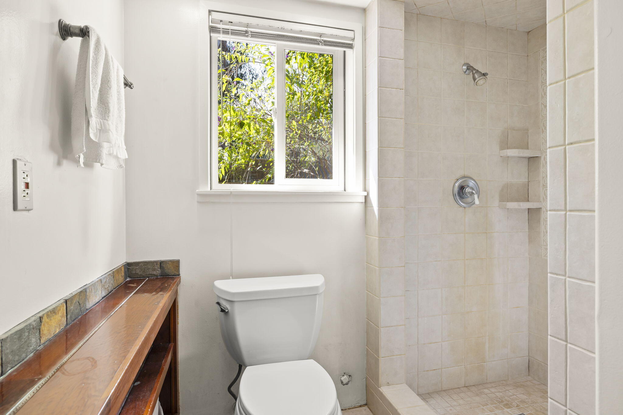5130 Cathedral Oaks Road Santa Barbara, CA 93111 - Photo 45 of 68 a white toilet sitting next to a bathroom sink