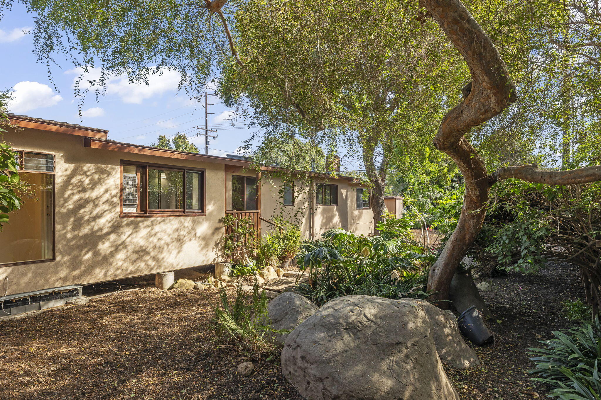 5130 Cathedral Oaks Road Santa Barbara, CA 93111 - Photo 6 of 68 a view of a house with a yard