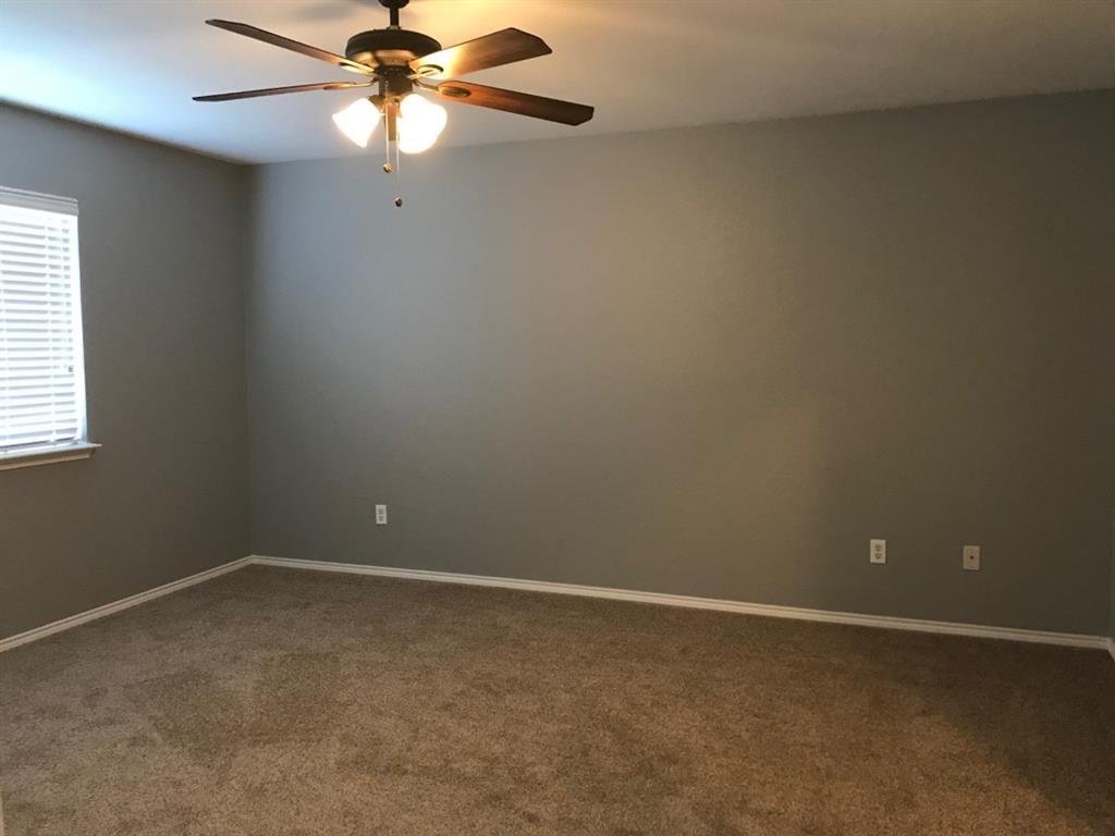 3305 Rustic Meadow Trail Mansfield, TX 76063 - Photo 7 of 12 Spacious room featuring neutral-toned walls, plush carpeting, and a ceiling fan with integrated lighting