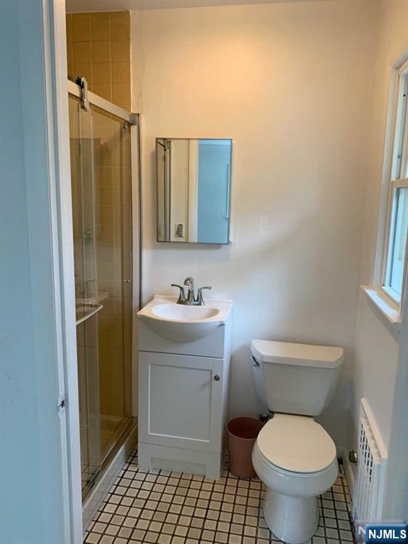 73 East Gouverneur Avenue Rutherford, NJ 07070 - Photo 16 of 33 a bathroom with a toilet sink and a mirror