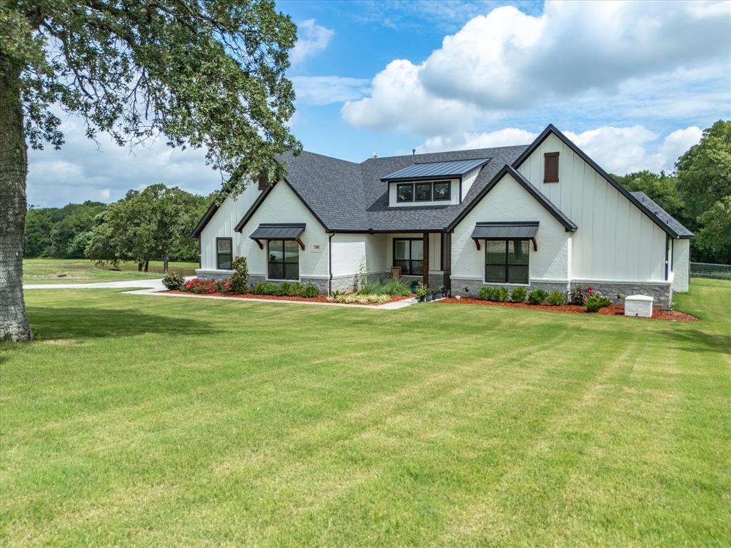 209 Rio Rancho Drive Decatur, TX 76234 - Photo 1 of 34 a front view of house with yard and green space