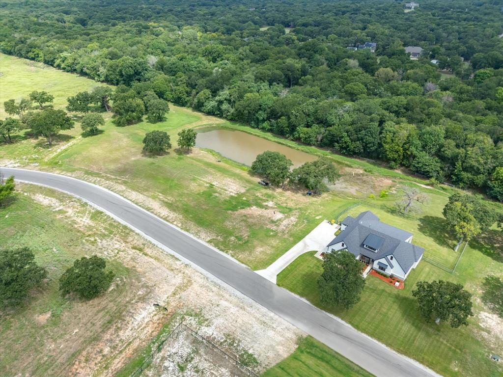 209 Rio Rancho Drive Decatur, TX 76234 - Photo 32 of 34 a view of a yard with an outdoor seating