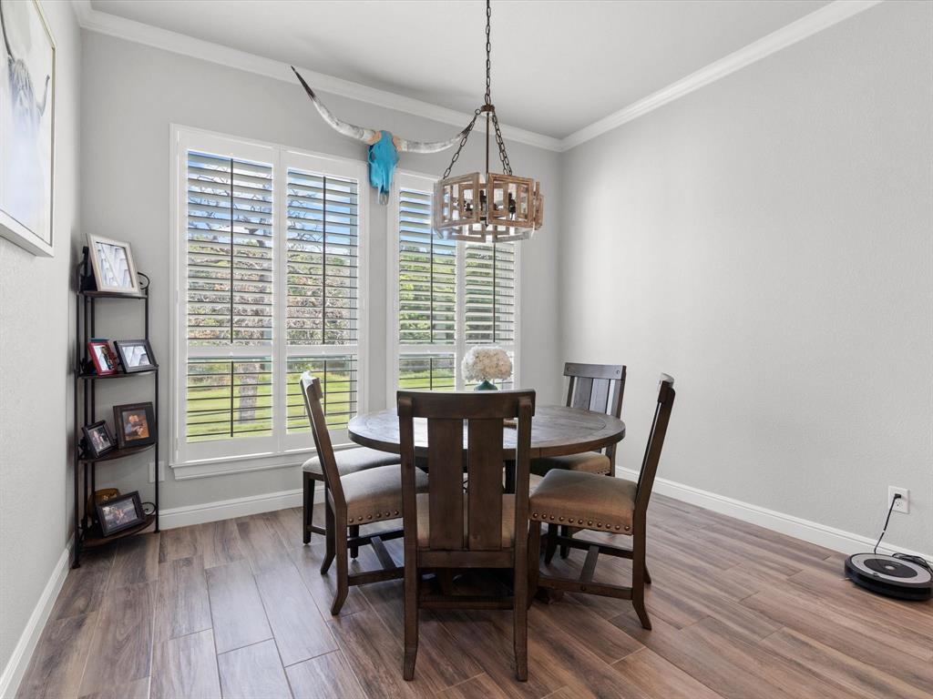 209 Rio Rancho Drive Decatur, TX 76234 - Photo 10 of 34 a view of a dining room with furniture window and wooden floor