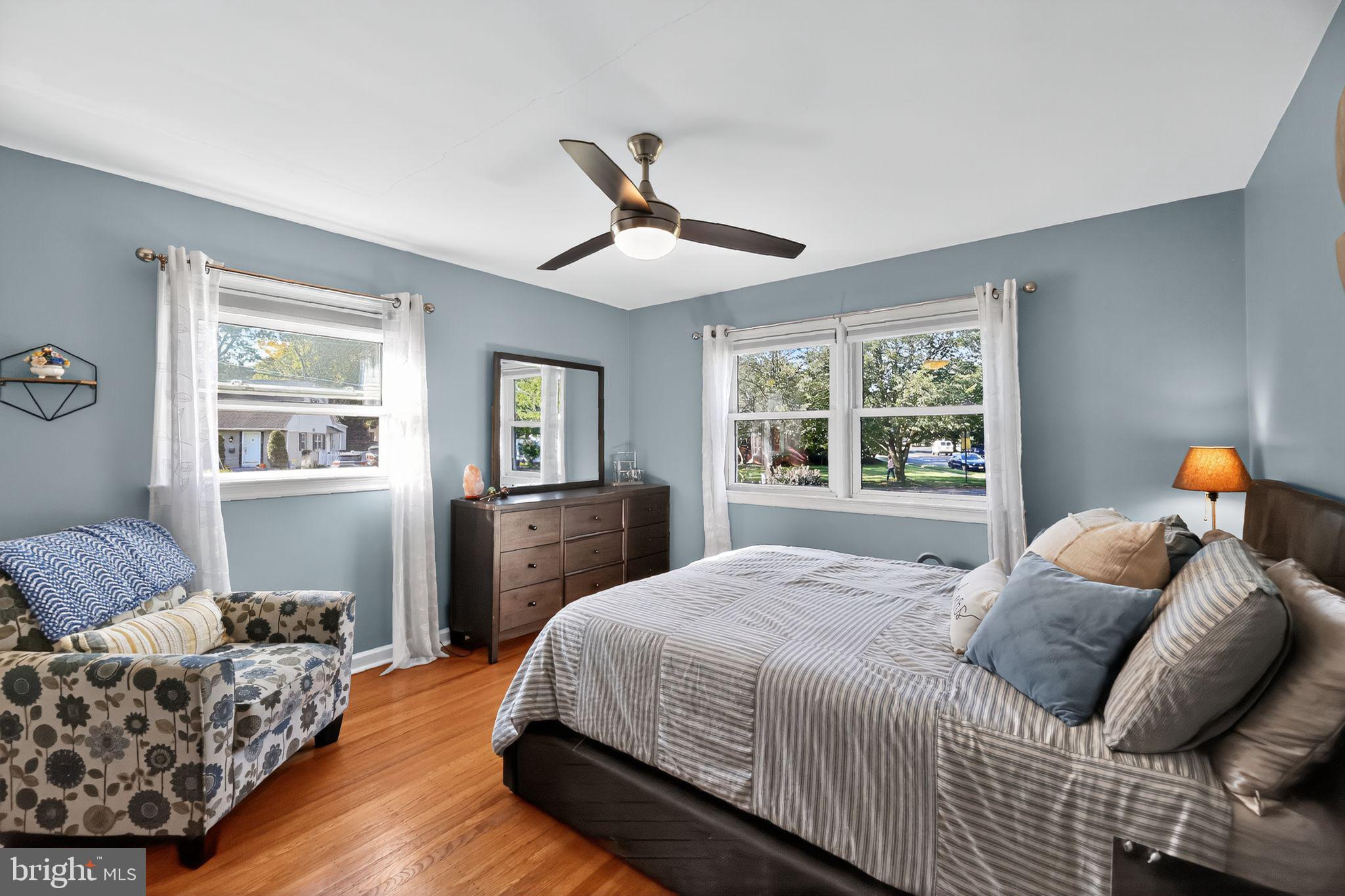 1201 Wayne Road Haddonfield, NJ 08033 - Photo 16 of 36 a bedroom with a bed and wooden floor