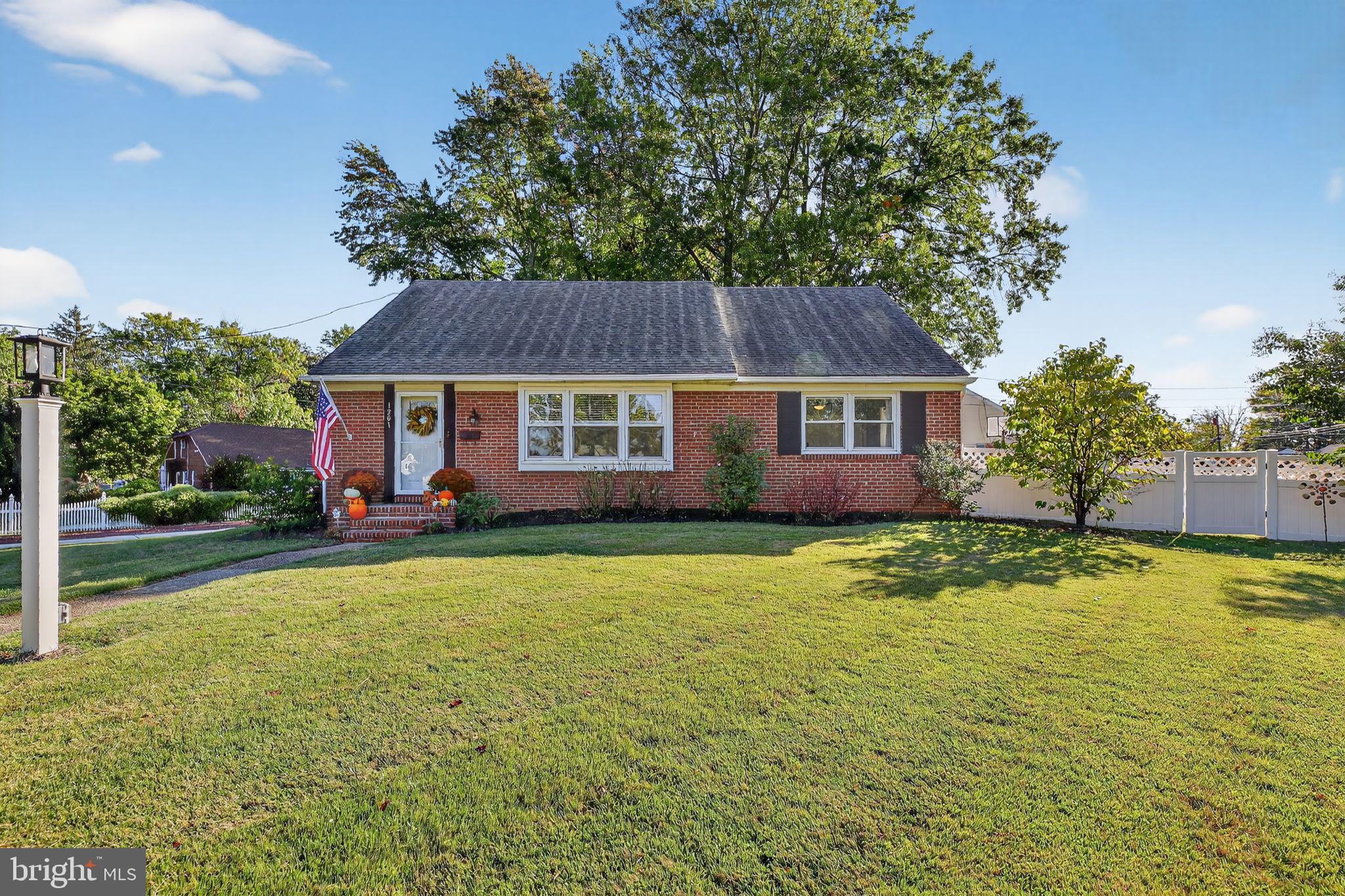 1201 Wayne Road Haddonfield, NJ 08033 - Photo 2 of 36 a house view with swimming pool and garden space