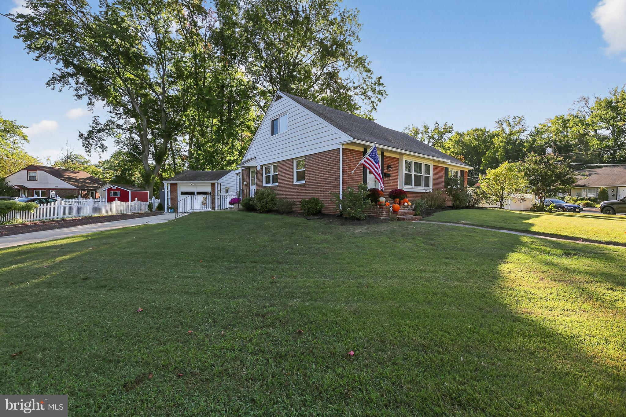1201 Wayne Road Haddonfield, NJ 08033 - Photo 3 of 36 a house view with swimming pool in front of it