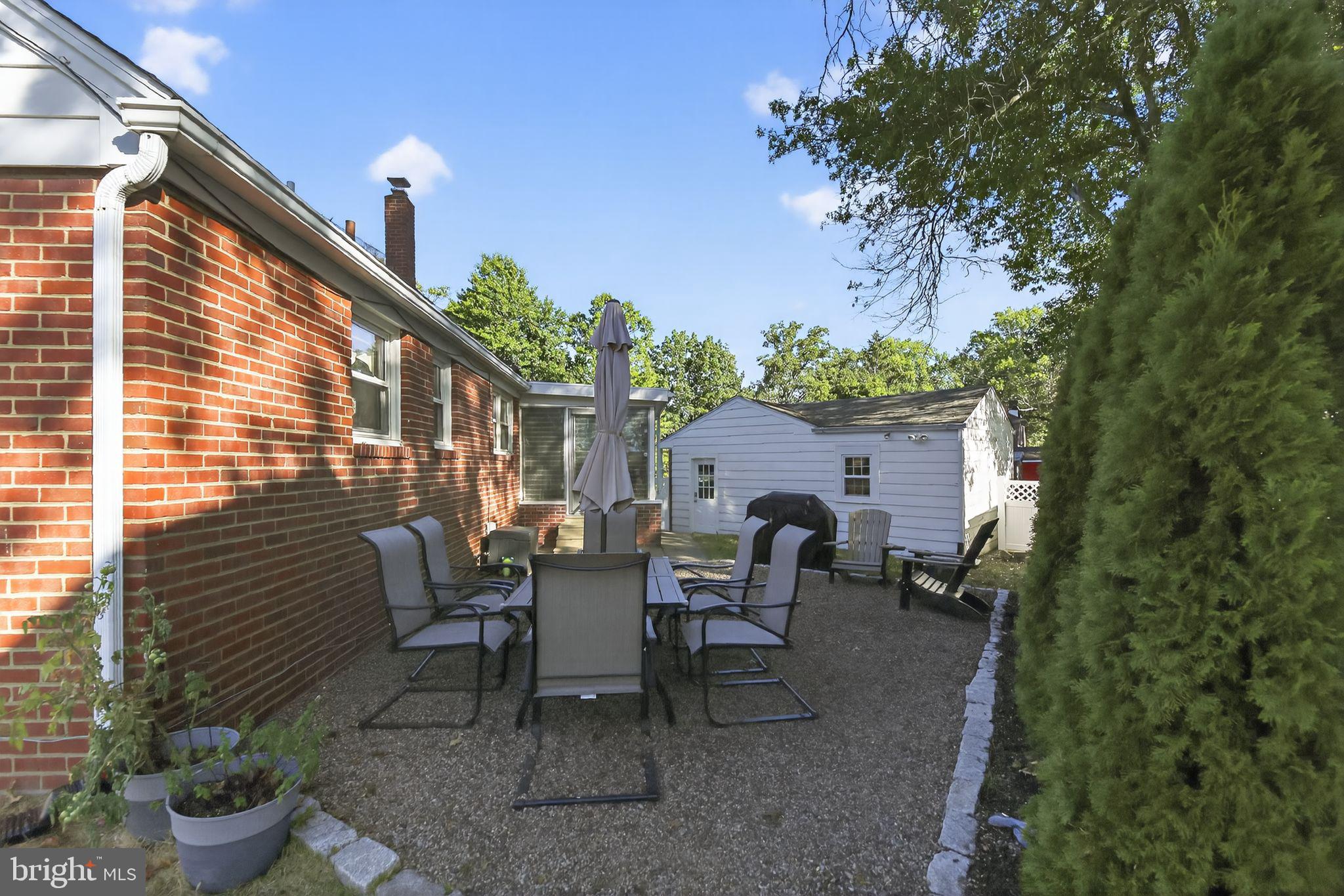 1201 Wayne Road Haddonfield, NJ 08033 - Photo 32 of 36 a view of a patio with table and chairs and potted plants