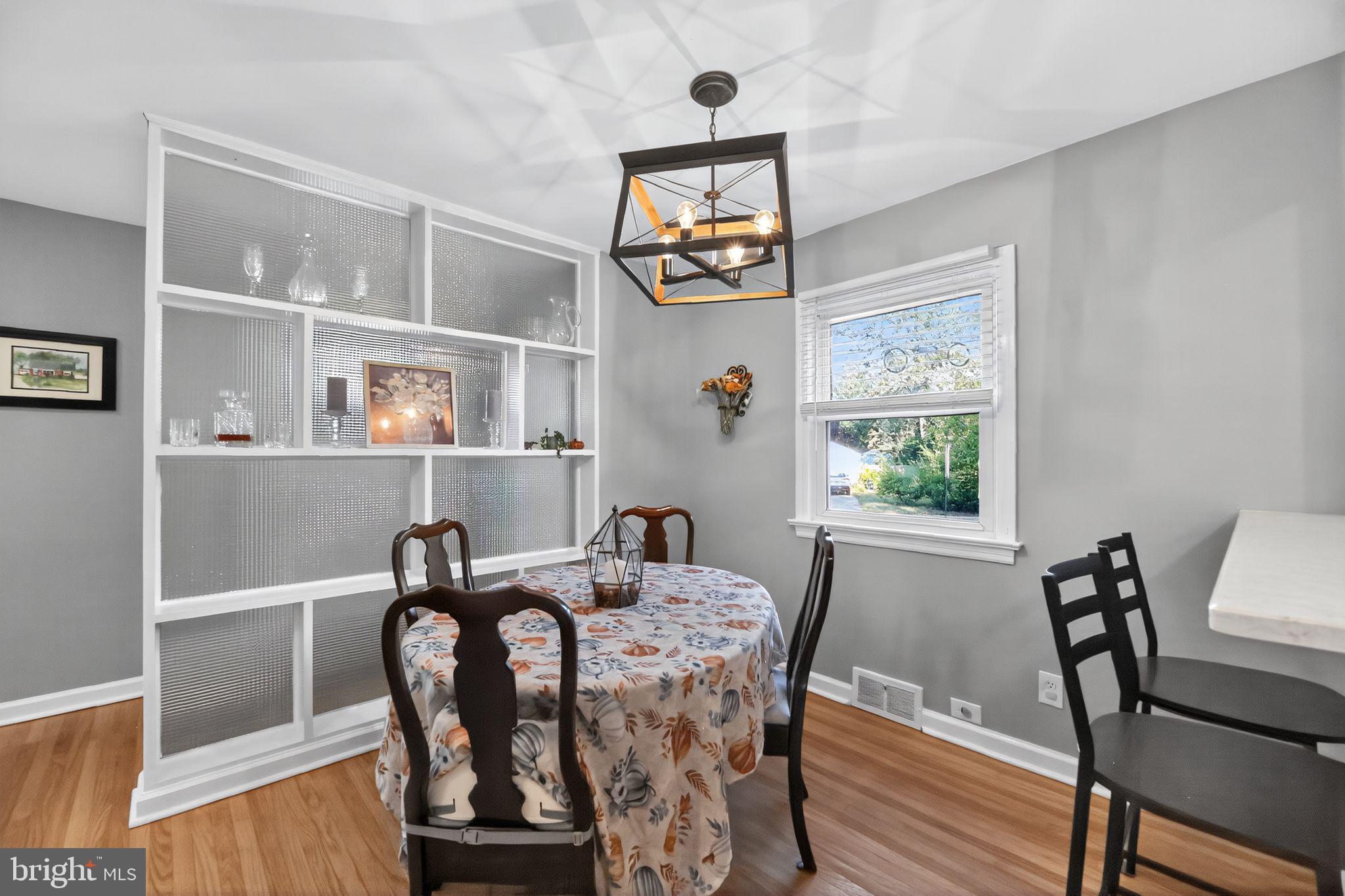 1201 Wayne Road Haddonfield, NJ 08033 - Photo 9 of 36 a view of a dining room with furniture window and wooden floor