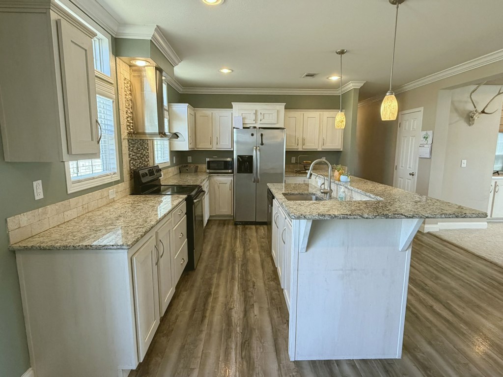 5200 Rr 1120 Rio Frio, TX 78879 - Photo 6 of 39 a kitchen with a sink stove and cabinets