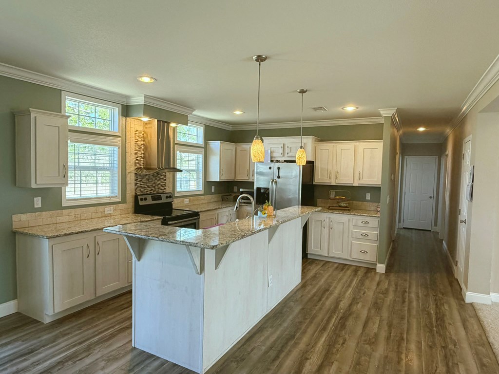 5200 Rr 1120 Rio Frio, TX 78879 - Photo 8 of 39 a large kitchen with stainless steel appliances granite countertop a lot of counter space and wooden floors
