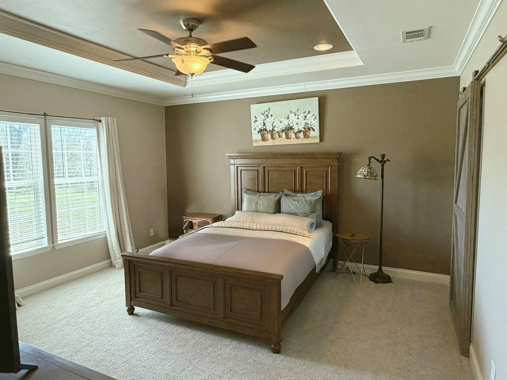 5200 Rr 1120 Rio Frio, TX 78879 - Photo 9 of 39 a bedroom with a bed and a chandelier