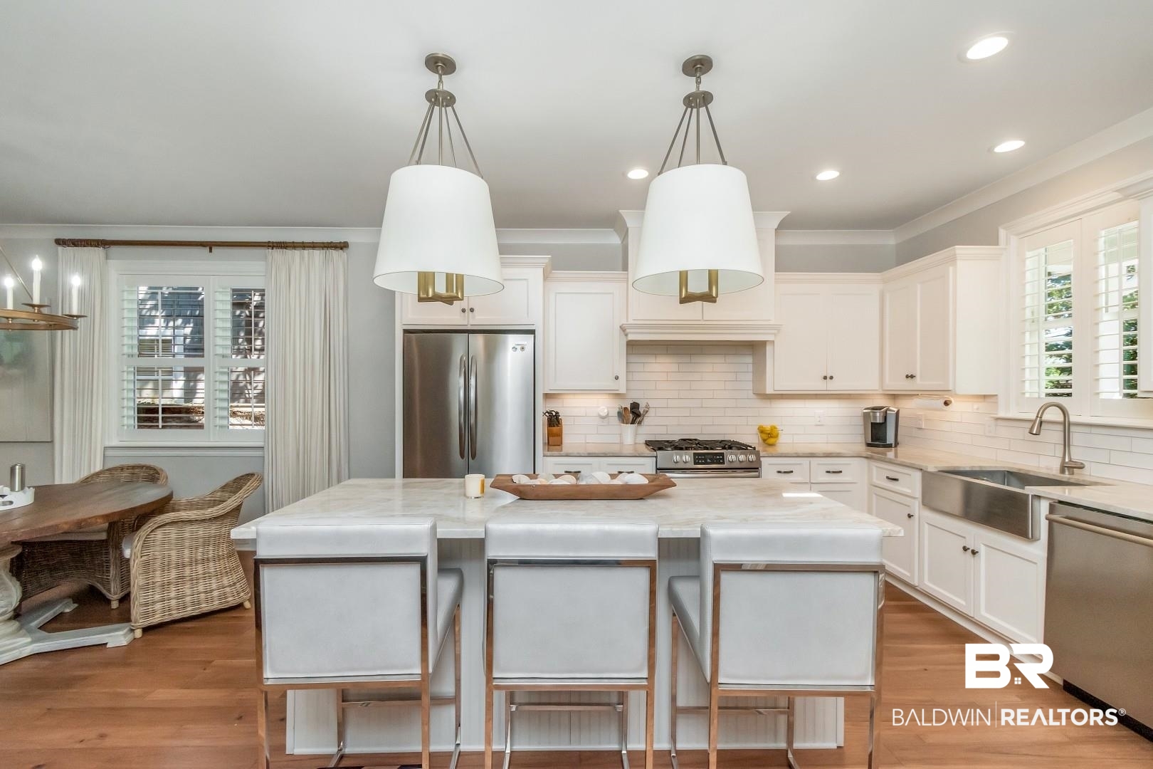 4404 Stein Street Mobile, AL 36608 - Photo 14 of 50 Kitchen with hanging light fixtures, stainless steel appliances, tasteful backsplash, crown molding, and white cabinetry
