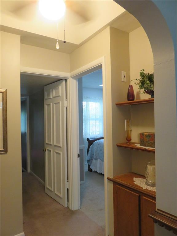 611 New Castle Road Slippery Rock, PA 16057 - Photo 11 of 24 The hallway to the bedrooms has built in cabinets and shelving.