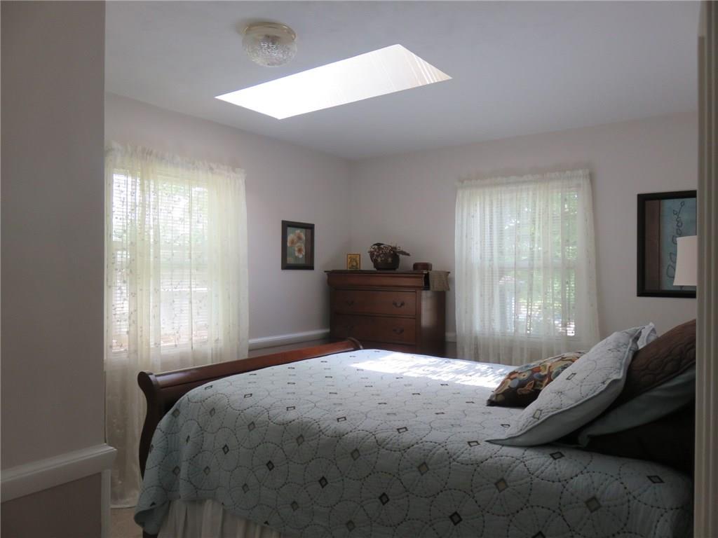 611 New Castle Road Slippery Rock, PA 16057 - Photo 12 of 24 Light and bright second bedroom with skylight and chair rail accent!