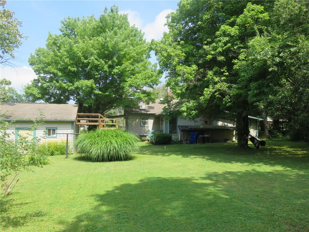 611 New Castle Road Slippery Rock, PA 16057 - Photo 22 of 24 The view from the rear of the property shows the back door to the garage to store your tractor.