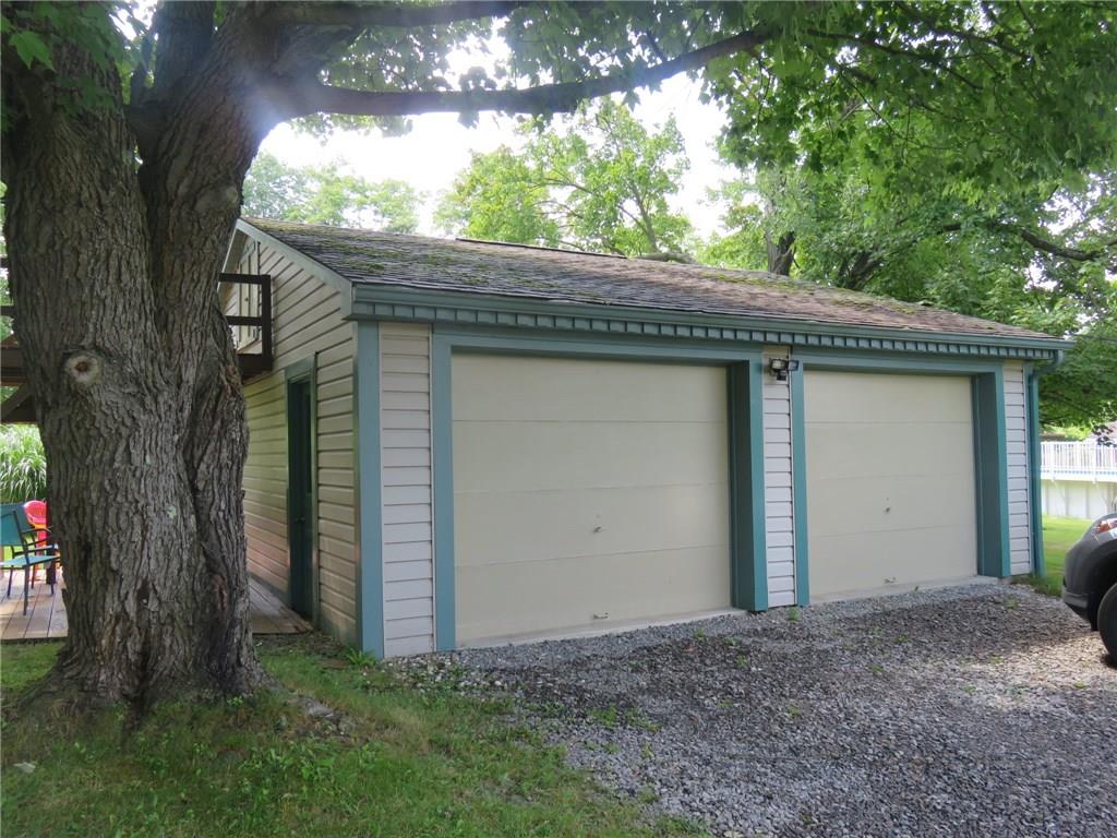 611 New Castle Road Slippery Rock, PA 16057 - Photo 4 of 24 Oversized two car garage with shelving, tools and second level is a handyman's dream!