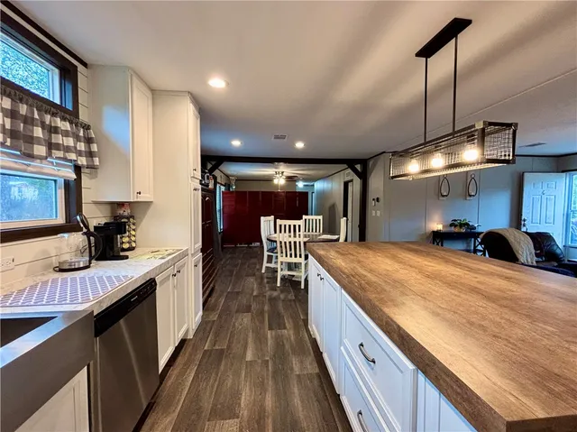 a view of a house with a yard and sitting area
