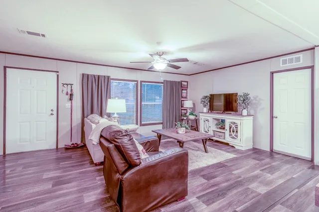 a view of washer and dryer with bathroom in the background