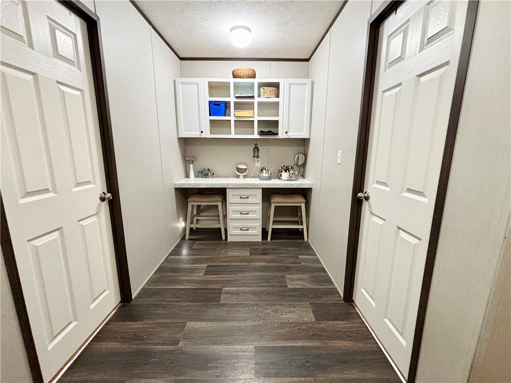 7715 Walnut Tree Lane Plantersville, TX 77363 - Photo 14 of 41 a view of a kitchen with wooden floor and electronic appliances