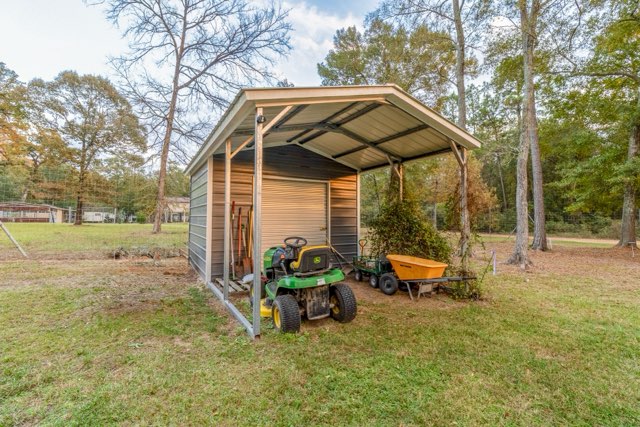 7715 Walnut Tree Lane Plantersville, TX 77363 - Photo 38 of 41 View of outbuilding with view of scattered trees