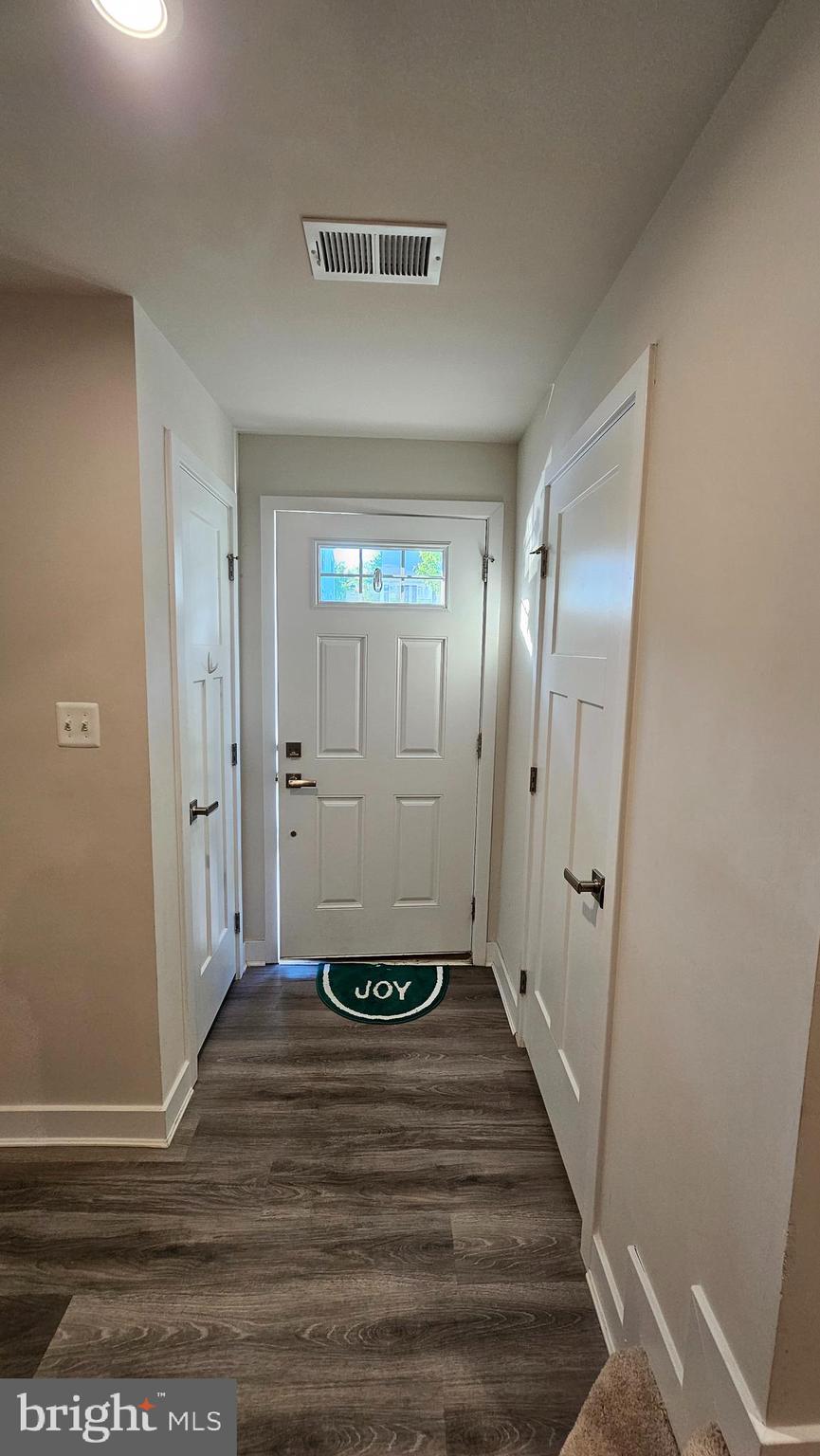 2055 Rivers Drive Newark, DE 19702 - Photo 15 of 48 a view of a hallway with wooden floor