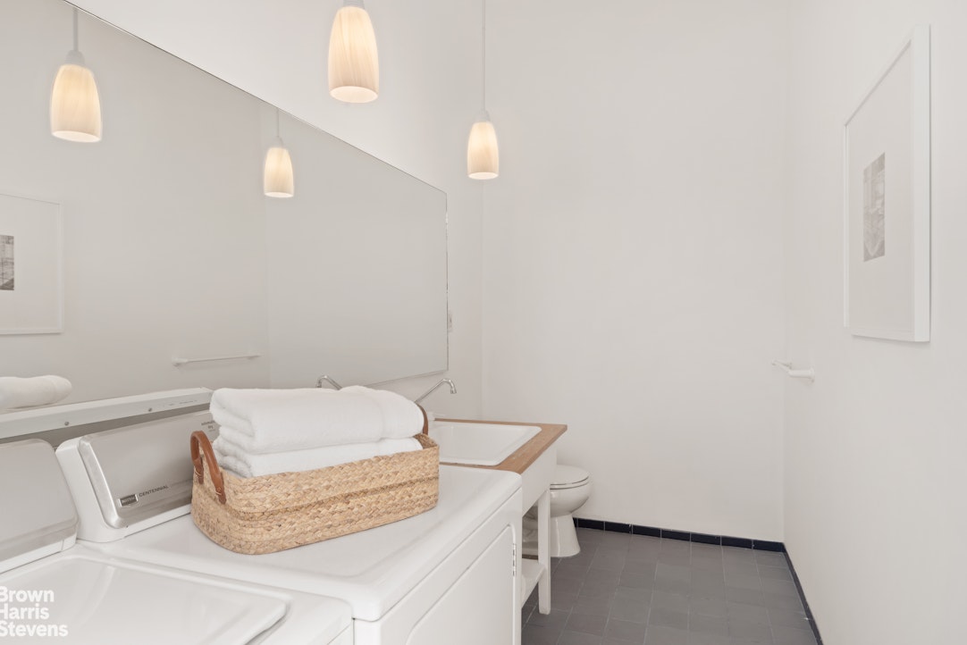 152 Wooster Street, Unit 5B Manhattan, NY 10012 - Photo 12 of 22 a bathroom with a sink and a toilet