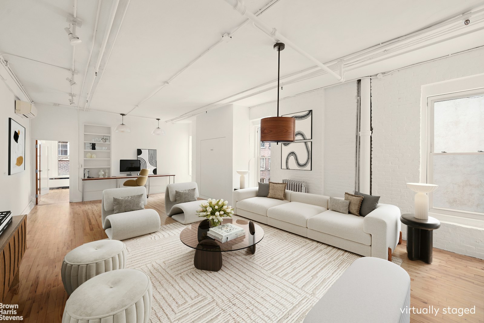 152 Wooster Street, Unit 5B Manhattan, NY 10012 - Photo 15 of 22 a living room with furniture a rug and white walls