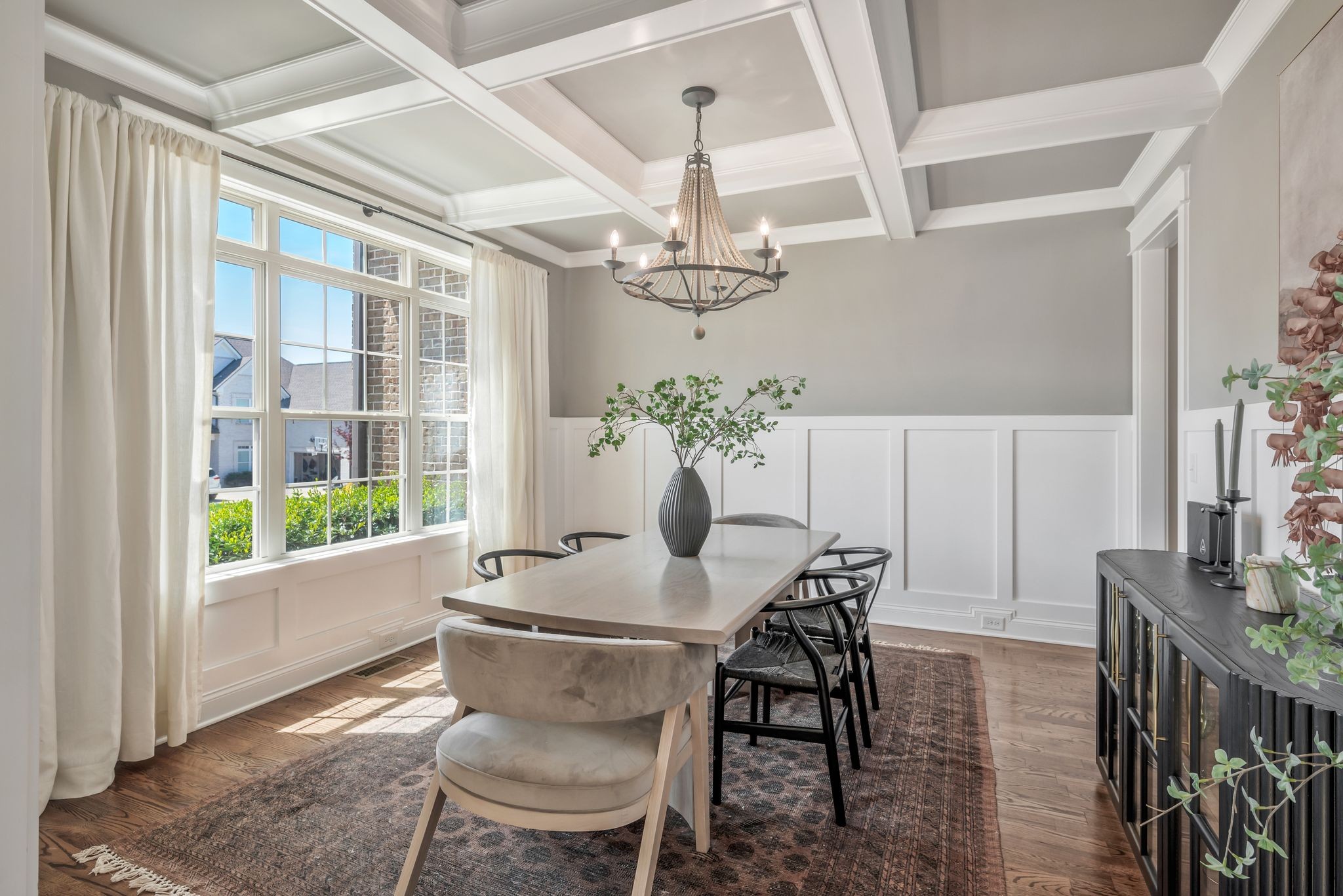 1009 Alpaca Drive Spring Hill, TN 37174 - Photo 12 of 48 a dining room with furniture a chandelier and wooden floor