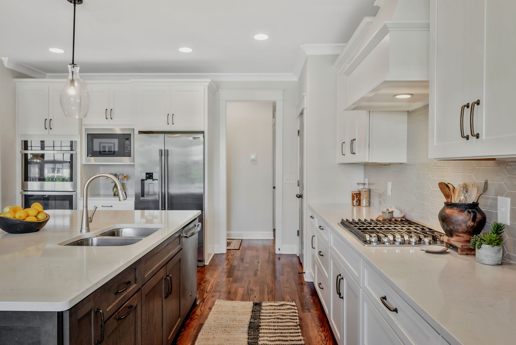 1009 Alpaca Drive Spring Hill, TN 37174 - Photo 20 of 48 a kitchen with a sink a stove and cabinets